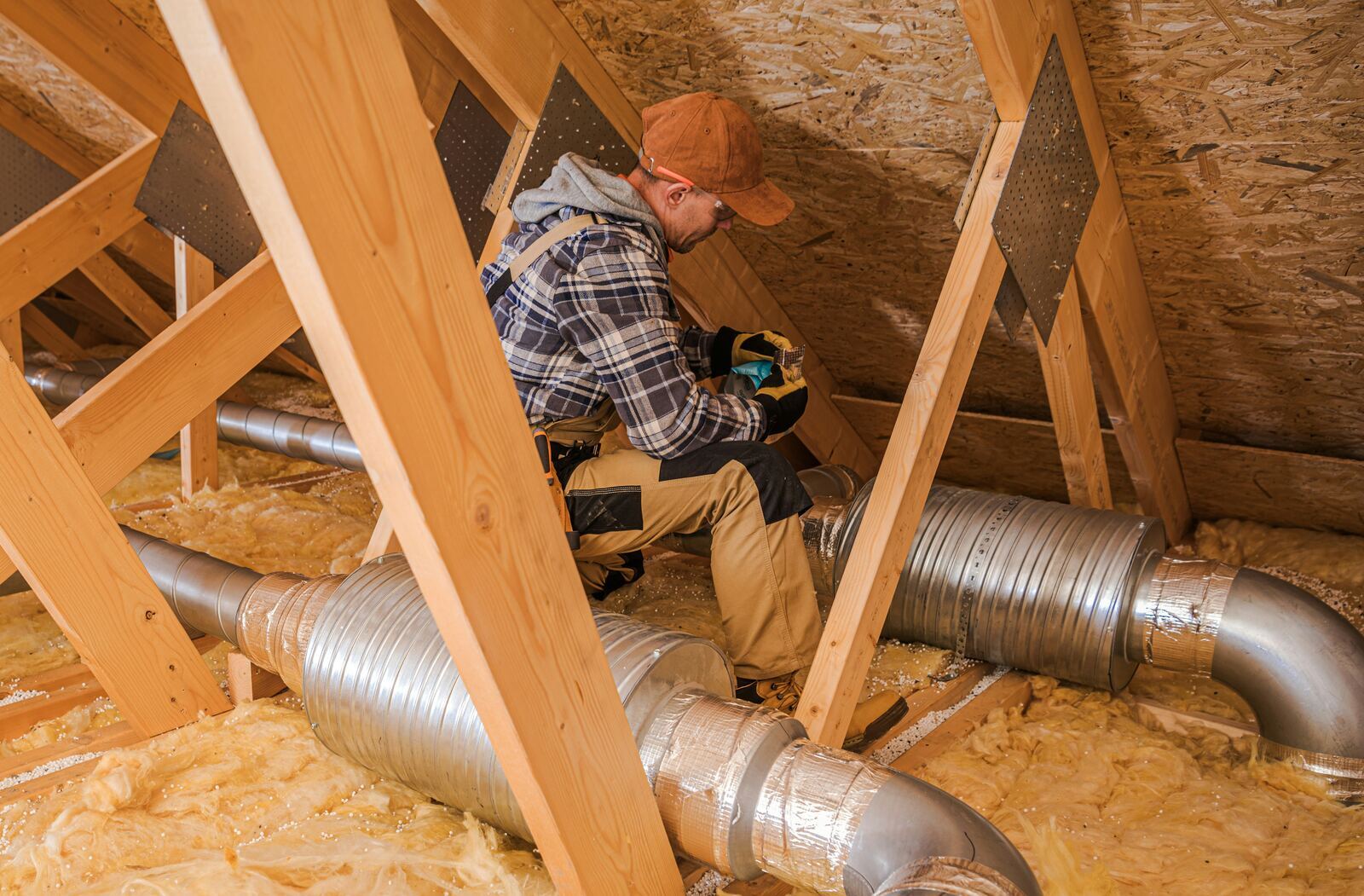 Before and after photos of an Irish attic showing improved loft insulation around the hatch.